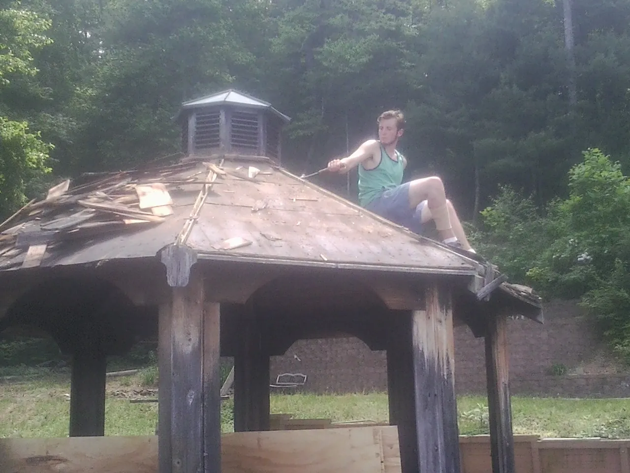 Tearing the old roof off a wooden gazebo before new shakes in Palos Verdes Peninsula